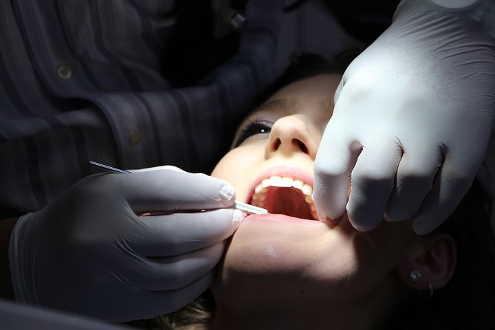 dentist checking a patient's teeth