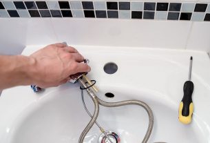 plumber fixing the sink