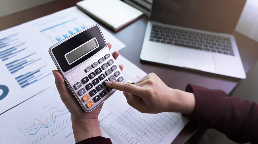 Accountant using a calculator